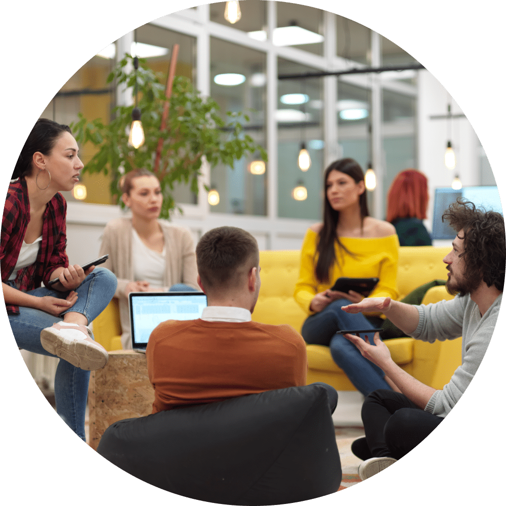 Business people group in modern office have a team meeting and brainstorming while working on tablet or laptop presenting ideas and take notes.
